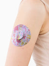 Freestyle Libre 2 Patch with colorful childhood memories design on arm.