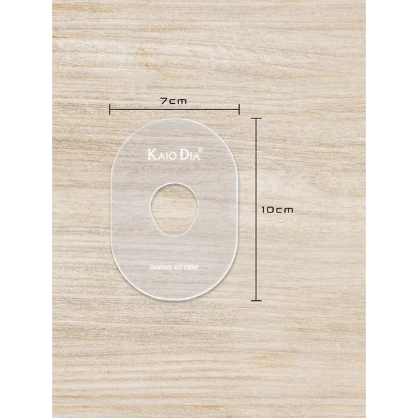 CGM Sensor Patch Template on wooden surface, dimensions 7cm by 10cm, transparent acrylic design.