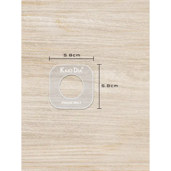 CGM Sensor Patch Template on wood surface displaying dimensions.