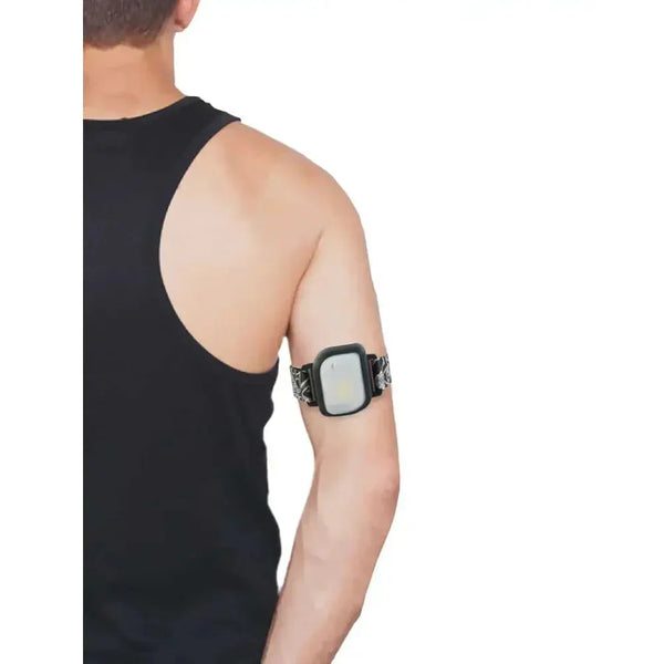 GlucoMen Day Insulin Patch Pump adjustable armband worn on upper arm.