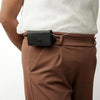 Leather insulin pump bag attached to trousers, showcasing elegant and secure design.