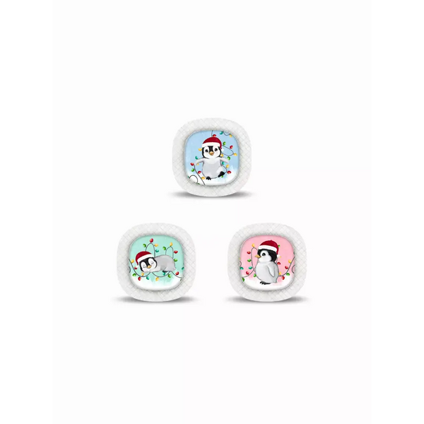 Three Christmas snow globes with cartoon penguins in Santa hats for Medtronic Simplera CGM