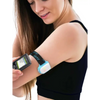 Omnipod insulin patch pump adjustable armband with colored clip in use on woman's upper arm.