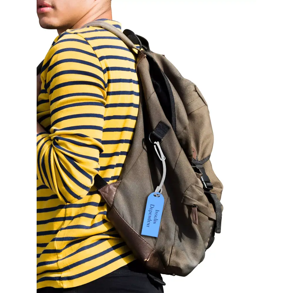 Diabetic luggage tag attached to backpack for easy identification.