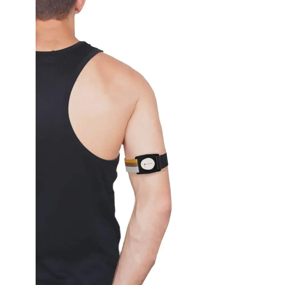 Black and tan tennis elbow brace on arm with Dexcom G7 Armband Summer Edition Rotating Clip