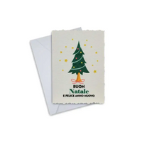 Elegant Christmas greeting card with festive tree design and envelope.