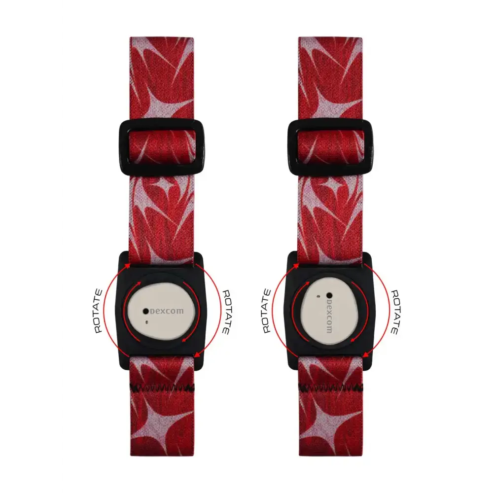 Red patterned Dexcom G7 Armband with rotating clip, featuring black buckles and white faces