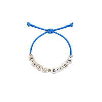 Diabetic bracelet with blue cord and letter beads, promoting diabetes awareness.