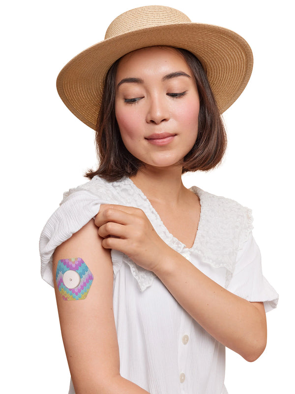 FreeStyle Libre 2 hexagonal shape patch worn on a woman’s arm, with breathable adhesive fabric for sensor support