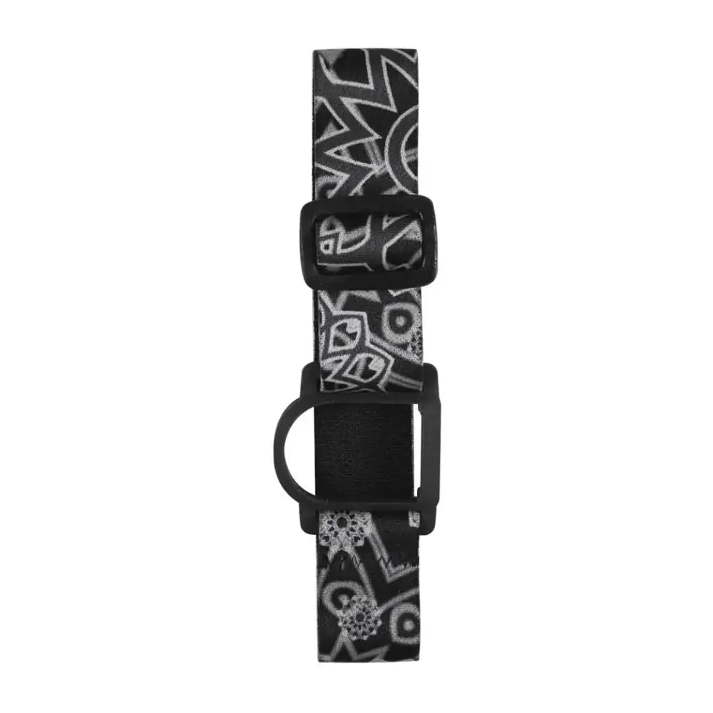 GlucoMen Day CGM armband adjustable black and white patterned strap for blood glucose sensor with secure fit and reusable tin box.