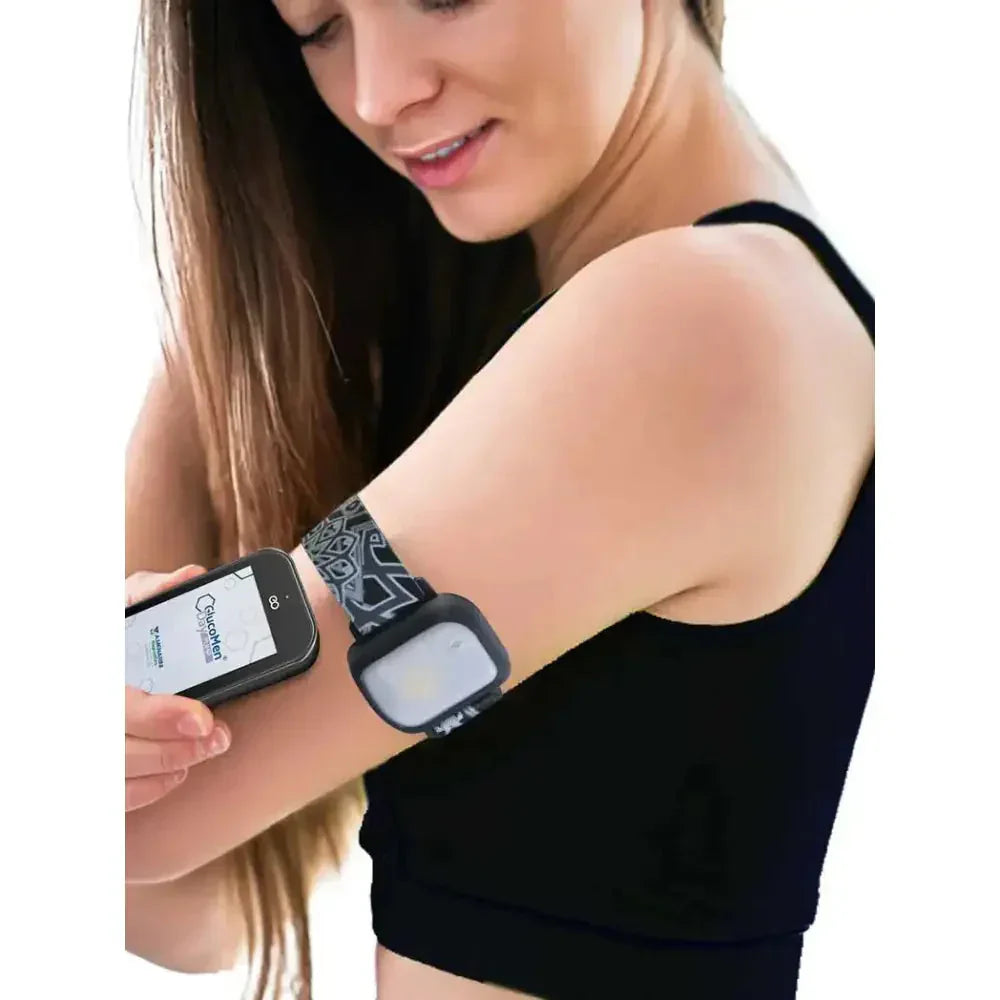 Woman wearing GlucoMen Day adjustable armband for insulin patch pump.