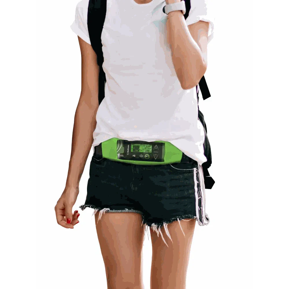 Insulin pump belt featuring a transparent view window worn by a person in casual attire.