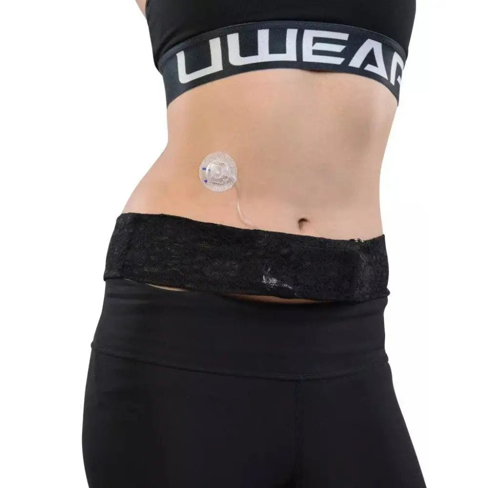 Insulin pump lace waist belt shown on a woman's waist, comfortable fit with secure pocket for infusion tubing.