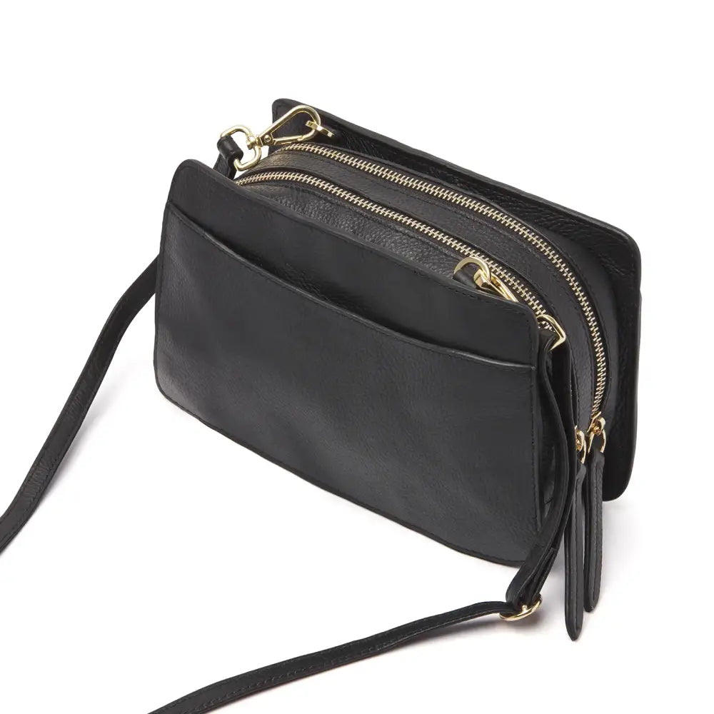 Black leather diabetic supplies shoulder bag with multiple compartments, adjustable strap, and magnetic closure.