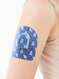 Adesivo de fixação para pod Omnipod, padrão Astronaut, no braço