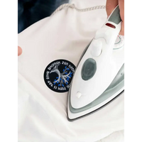 Viking-inspired embroidered diabetes awareness iron-on patch being applied to fabric.