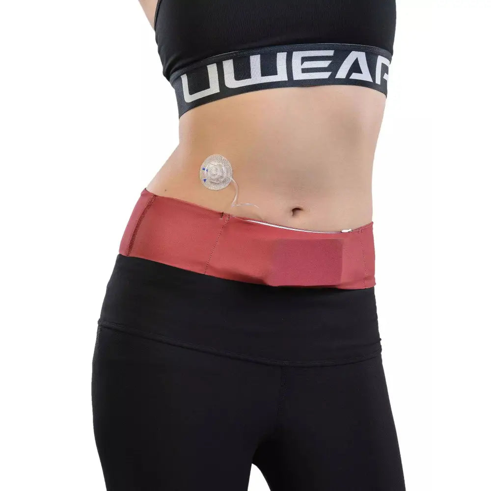 Universal Insulin Pump Waist Belt in solid color, fitted on waist with infusion tube, flexibility and comfort demonstrated.