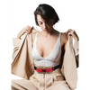 Woman wearing an elegant insulin pump pouch with lace detailing.