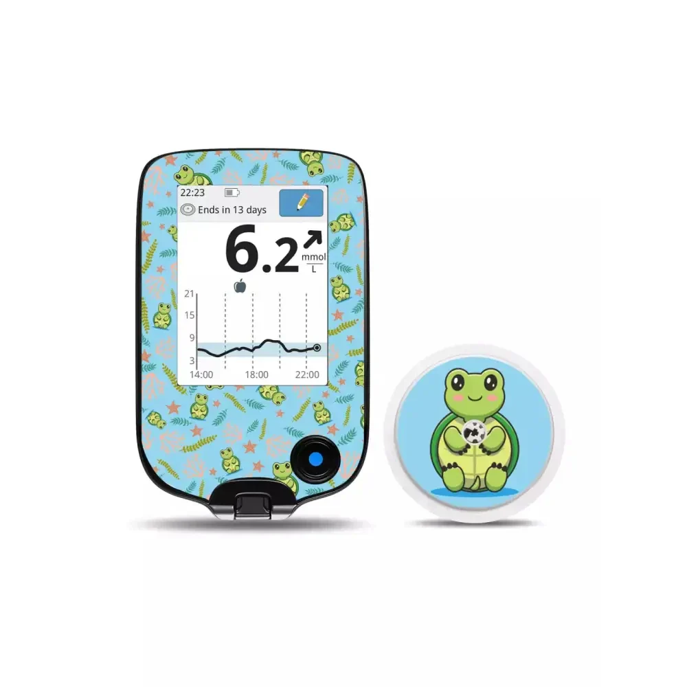 Freestyle Libre Reader and Sensor with frog-themed decorative vinyl stickers.