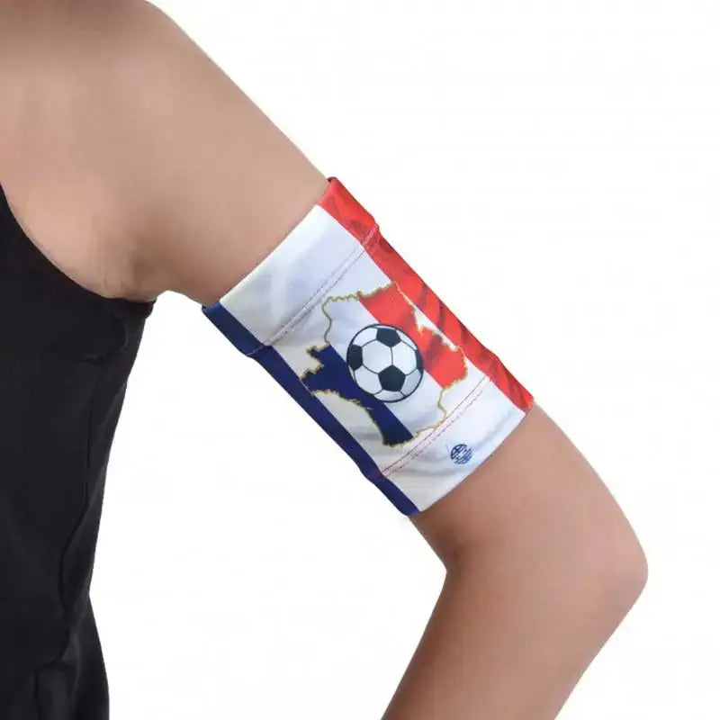 Glucose sensor armband for children with flag design, securely holding a sensor.