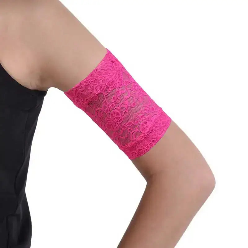 Lace armband protecting CGM and insulin pump on arm, pink color.